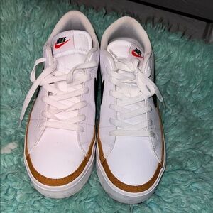 Nike Men’s White Sneakers with Brown Trim and Black Swoosh